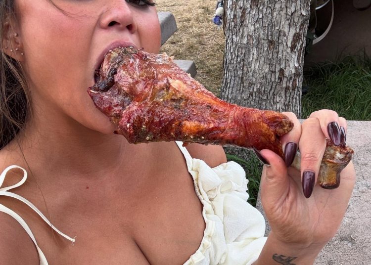 Chrissy Teigen shows off cleavage and chomps turkey leg in new snaps